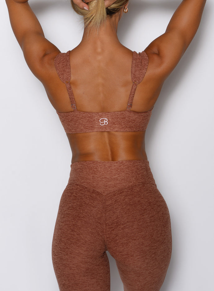 close up back side view of a model wearing the Halo Sports Bra in spiced chai color