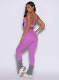 back left side profile view of a model wearing the Hardbody Leggings in Purple Rain color