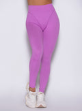 close up frontal view of a model wearing the Hardbody Leggings in Purple Rain color