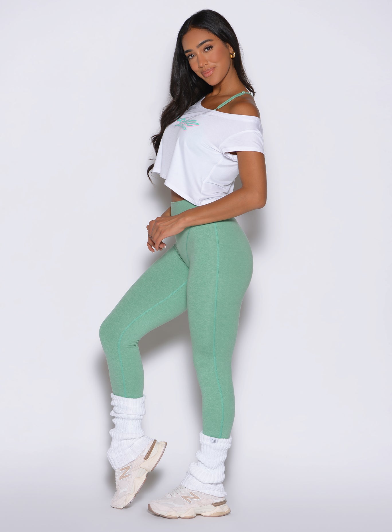 Side profile of Sage Hardbody Leggings featuring a high-cut thong leotard illusion.