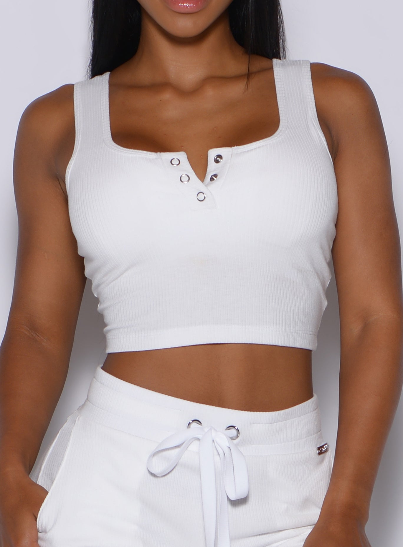 Zoomed in front view of our white henley long bra 