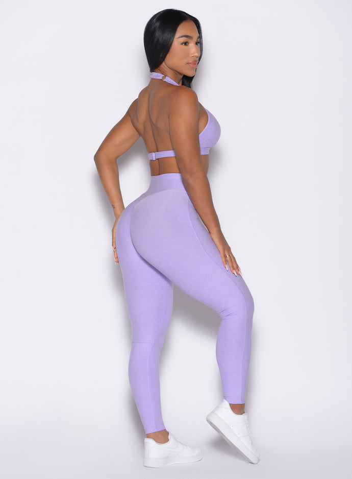 back right side profile view of a model wearing the Movement Leggings in Sugared Lilac color