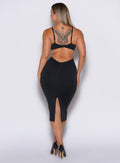 back  profile view of a model in our black hourglass dress