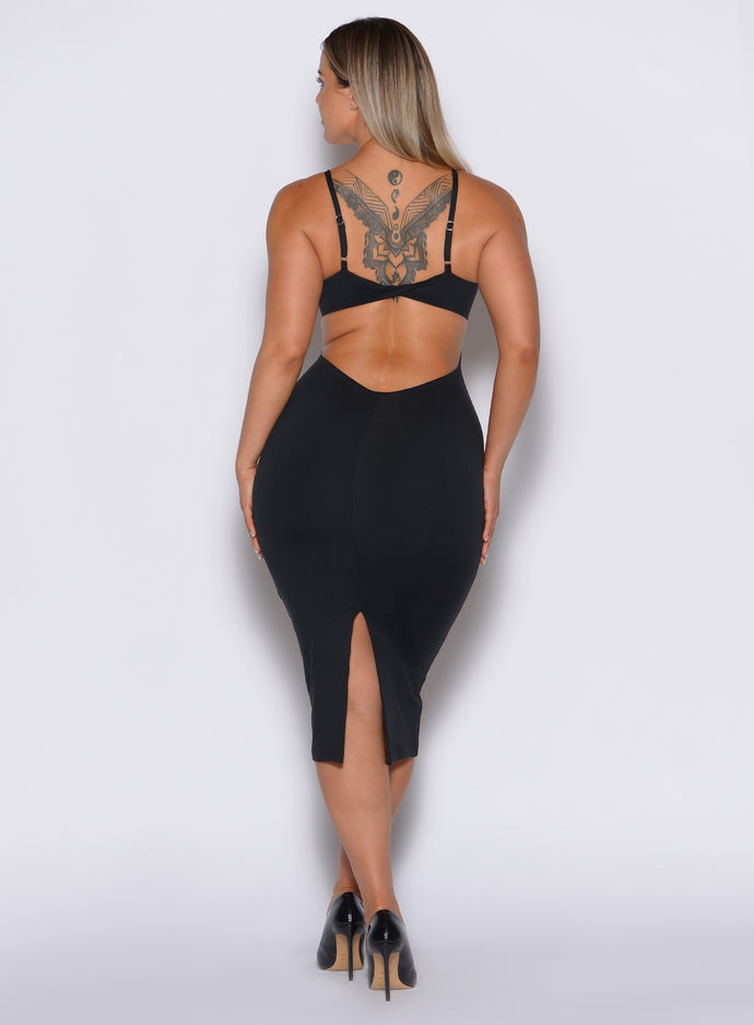back  profile view of a model in our black hourglass dress