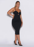 front  profile picture of a model wearing our black hourglass dress