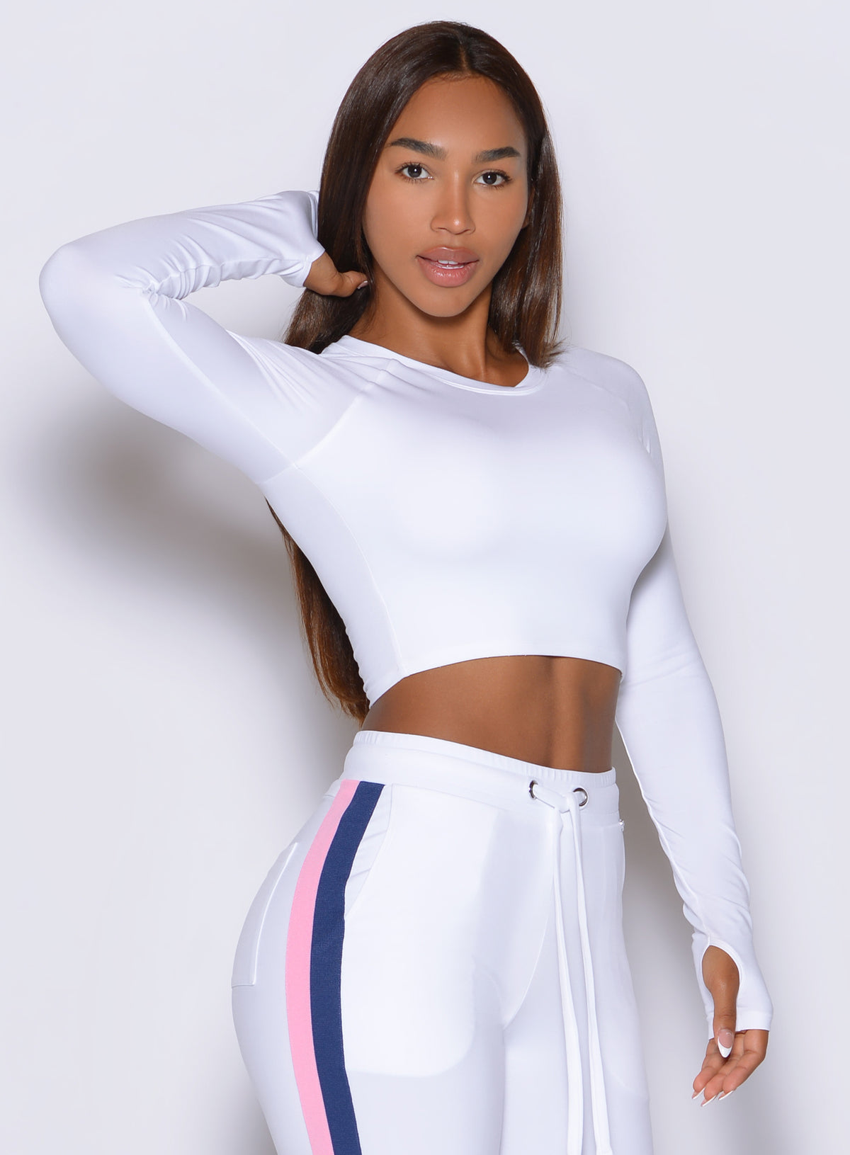 Three-quarter angle of Bombshell Sportswear White Impact Pullover in silky 4-way stretch fabric.