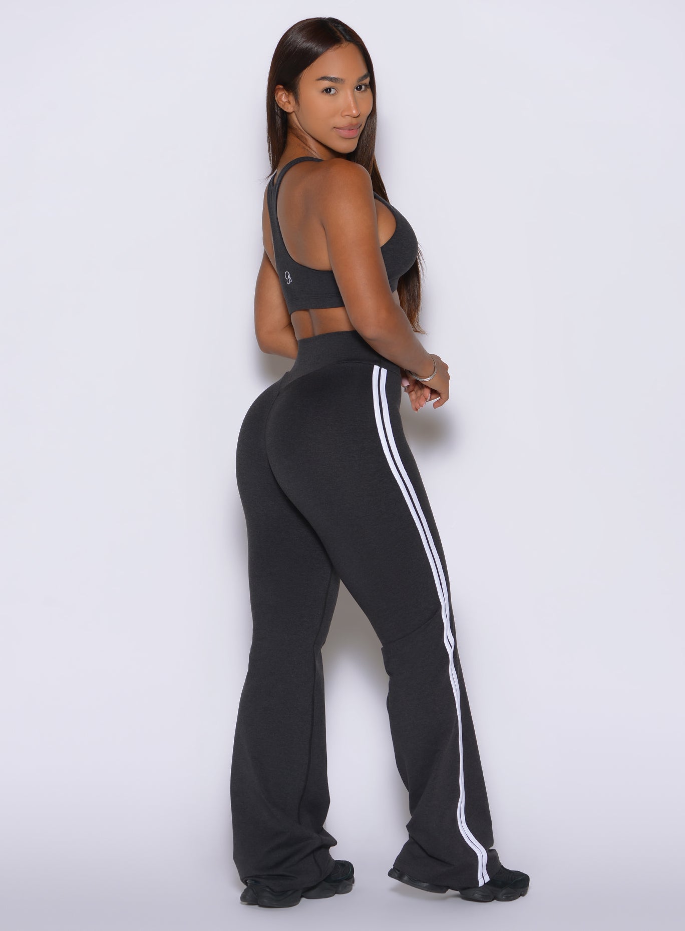 Double stripe binding traces the outer leg of Obsidian Black Inline Straight Leggings
