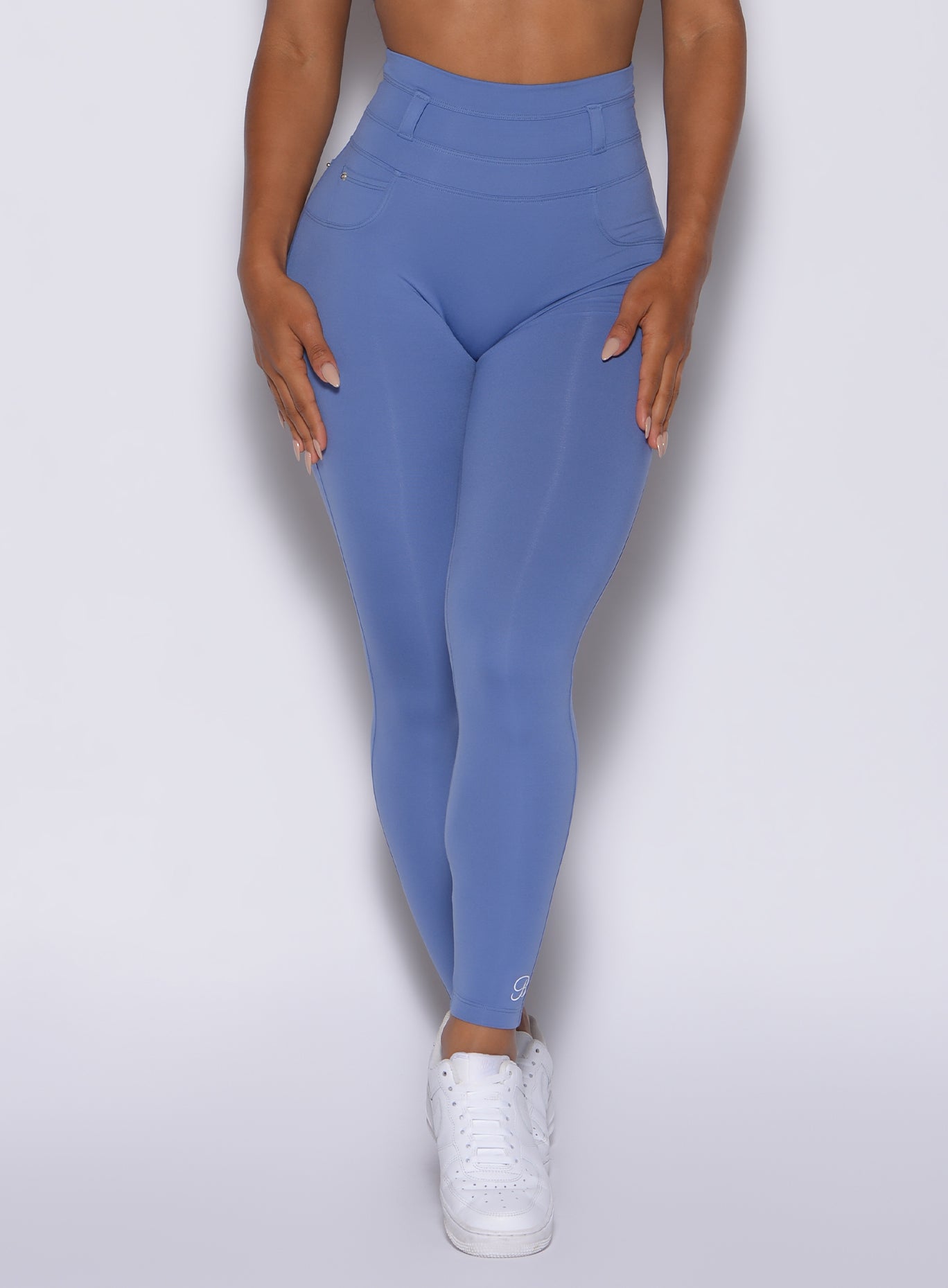 Front view of our peach bottoms leggings in denim blue color 