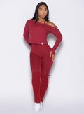 front profile view of a model looking to the left side wearing the Luxe Leg Warmers in red velvet color