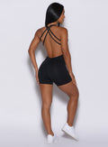 back profile view of a model in our black bodysuit shorts