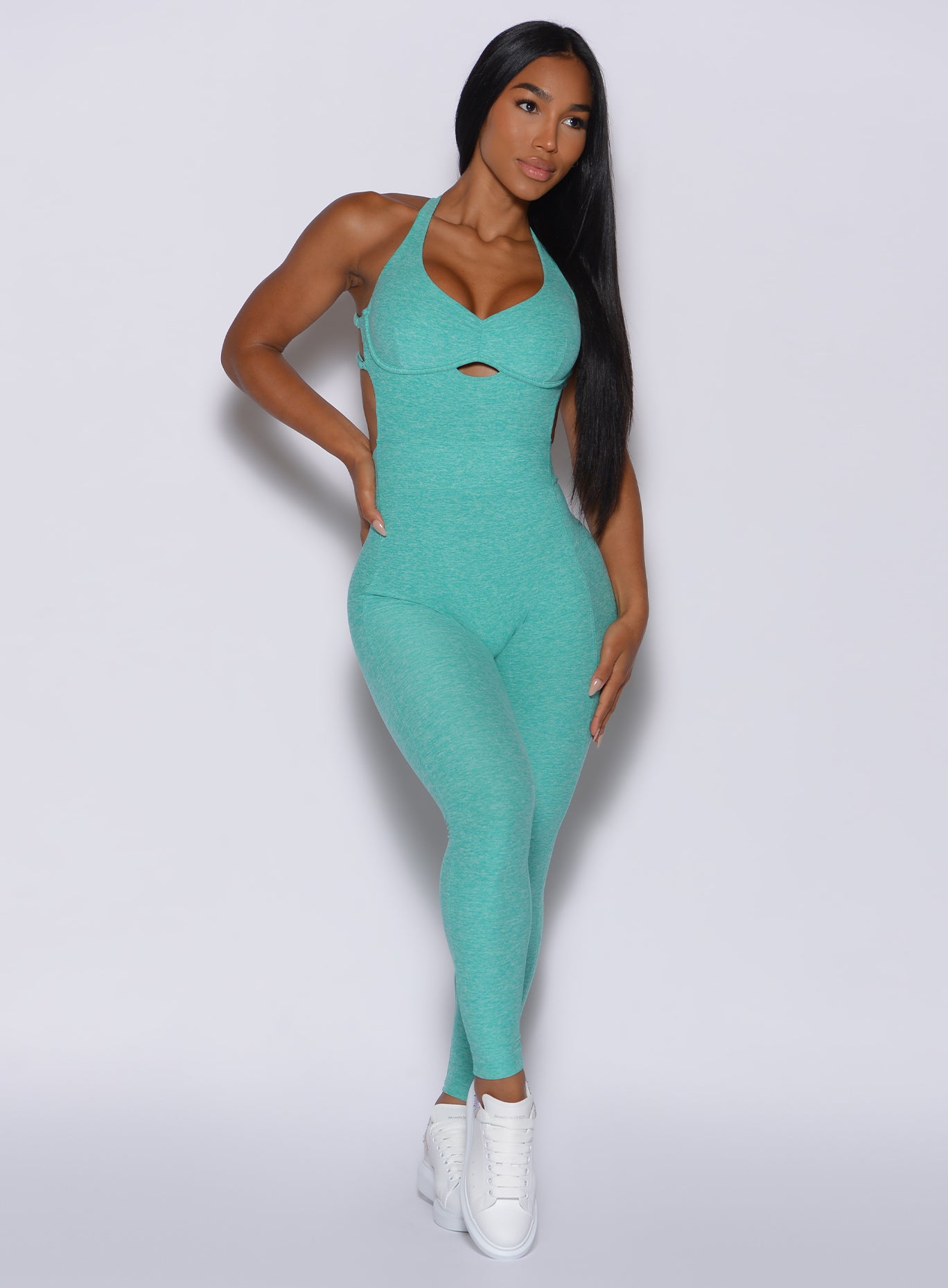 front profile picture of a model wearing our full length mint bombshell bodysuit