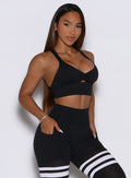 Black Keyhole Bralette profile view with ruched front and racerback for light gym workouts.