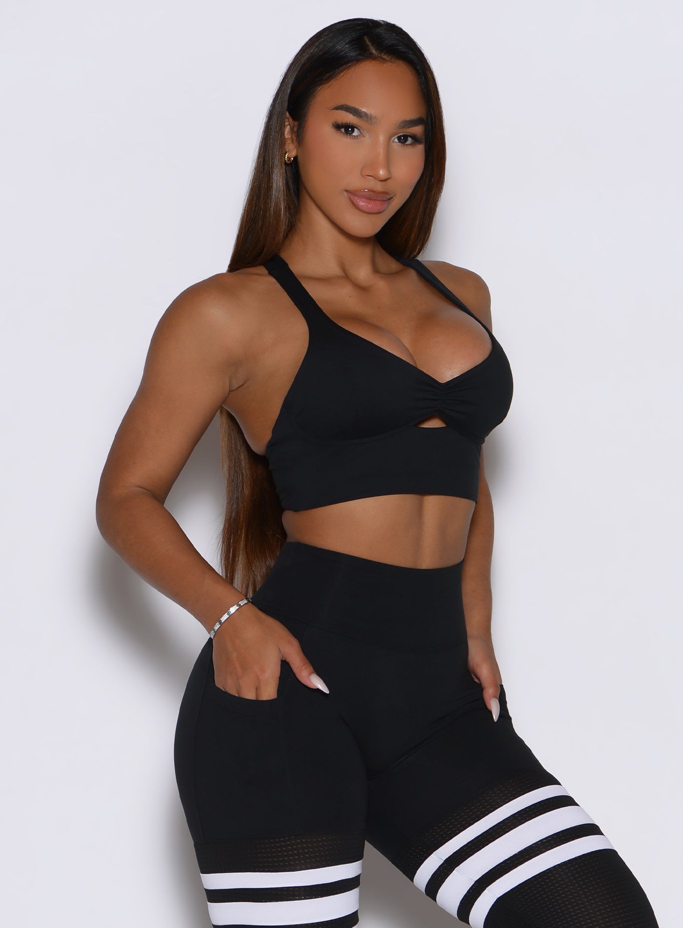 Black Keyhole Bralette profile view with ruched front and racerback for light gym workouts.