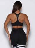 Black Keyhole Bralette featuring a sleek racerback and defined cups for sculpting gym support.