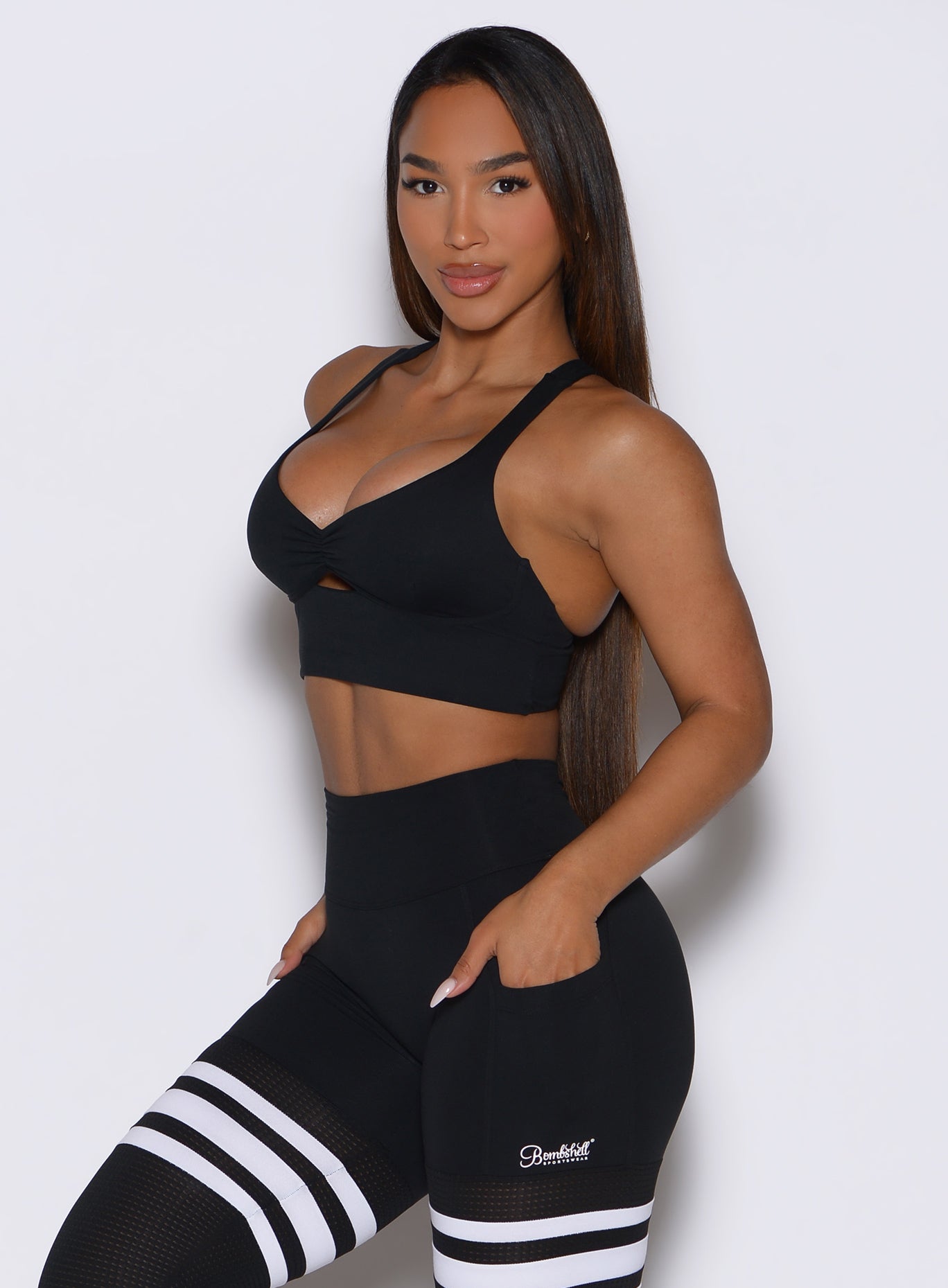 Side profile of the black Keyhole Bralette, featuring ruched details for a sculpting gym fit.