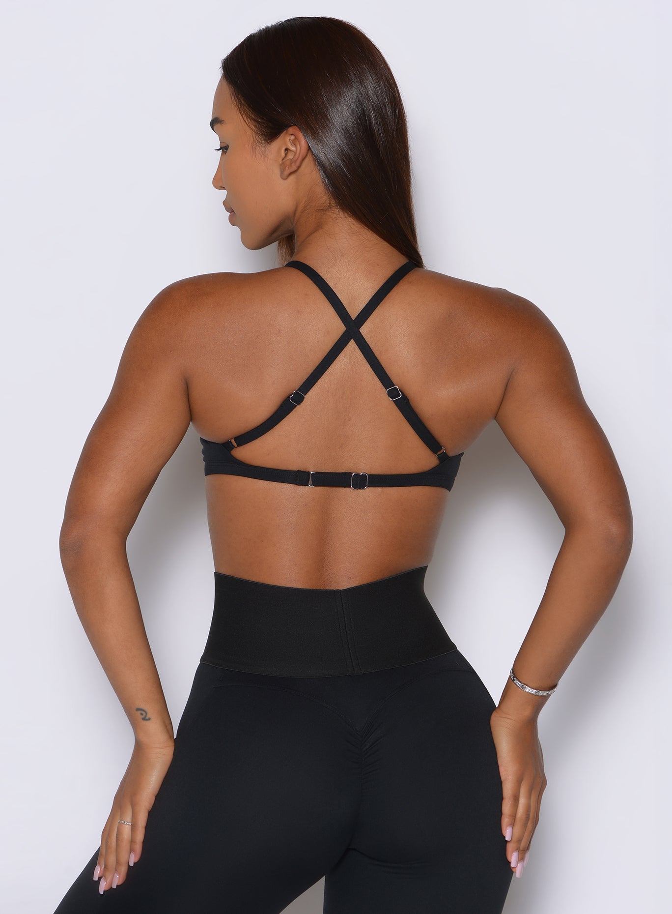 Black Kini Bra showcasing adjustable straps and nickel free alloy hardware for back day performance