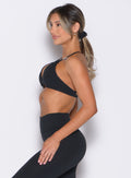 left side profile view of a model wearing the B Scrunchie in Black color