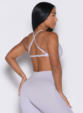 back right side profile view of a model wearing the Kini Bra in Galactic Lilac color