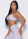 left side profile view of a model wearing the Kini Bra in Galactic Lilac color
