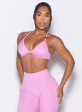 front profile view of a model wearing the Kini Bra in Lilac Chiffon color paired with the matching leggings