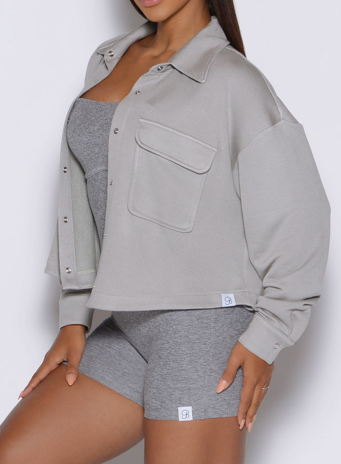 close up left side profile view of a model wearing the laidback luxe shirt in dark and stormy color