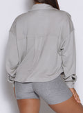 close up back profile view of a model wearing the laidback luxe shirt in dark and stormy color