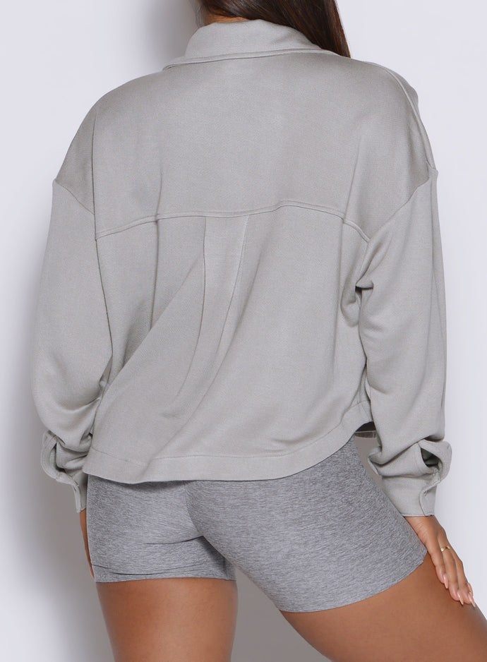 close up back profile view of a model wearing the laidback luxe shirt in dark and stormy color