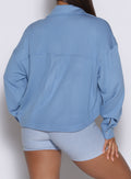 close up back profile view of a model wearing the laidback luxe shirt in Niagara mist color