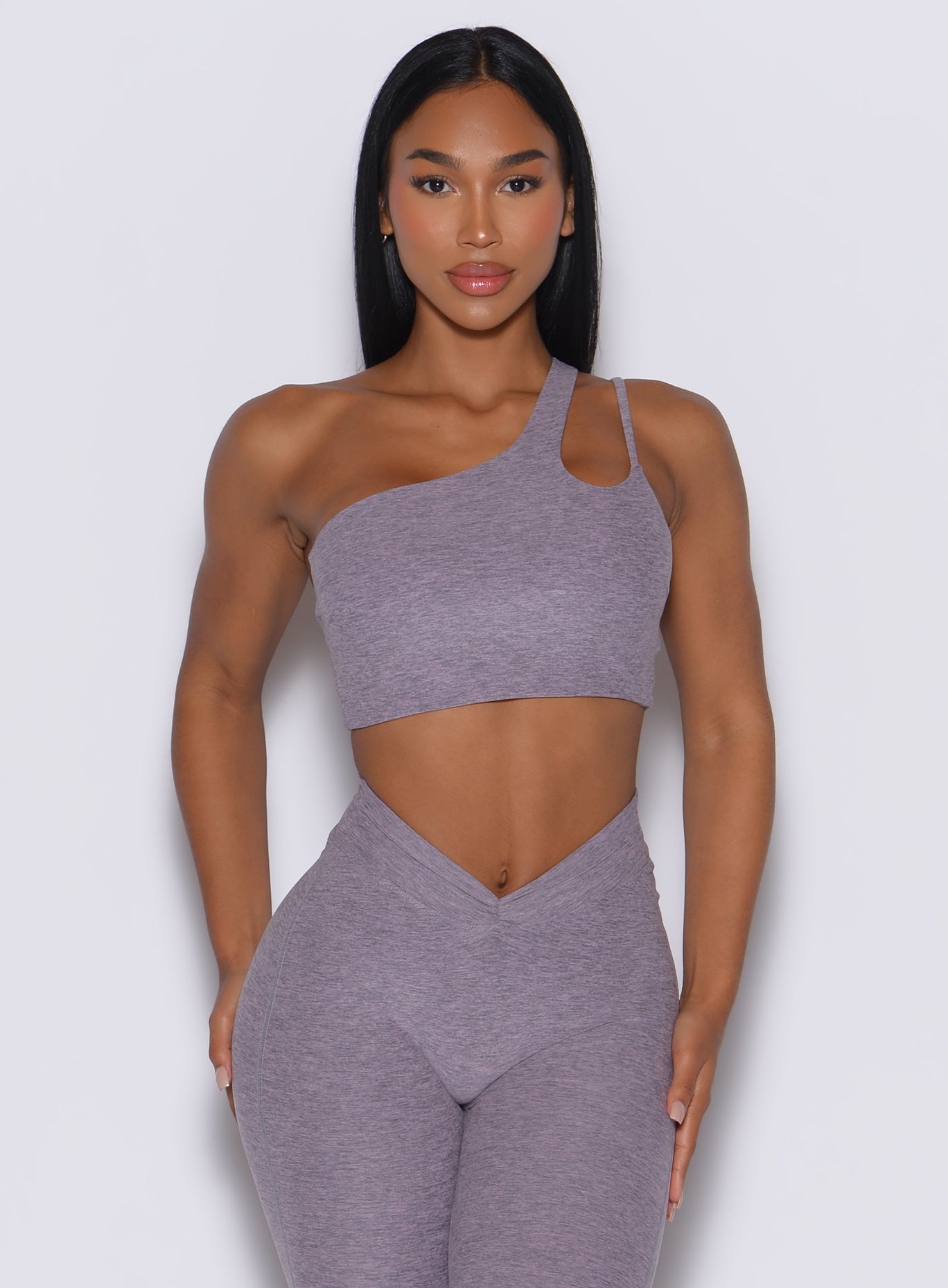 Model facingf forward wearing our lateral top in Lilac Grey along with a matching leggings