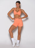 Front view of Citrus Glow Lift Contour Shorts with a crossover waistband and sculpting activewear fit.