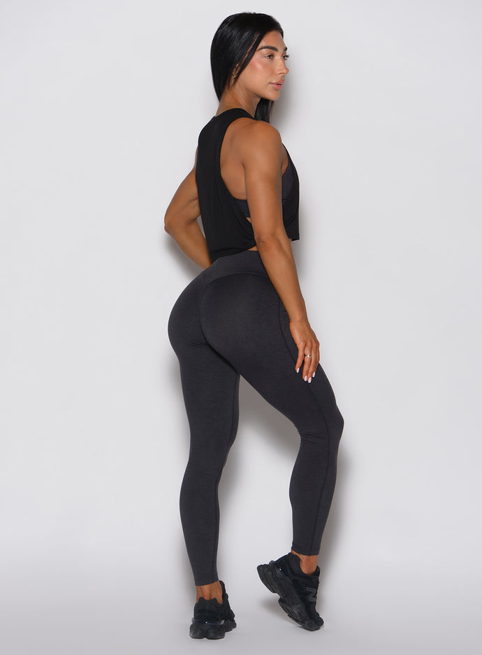 Right side profile of Heathered Black Lift Movement Leggings, sculpting high-waisted gym wear.