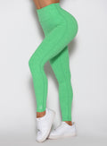 Close-up side view of Neon Miami Beach Lift Movement Leggings, sculpting seamless gym activewear.