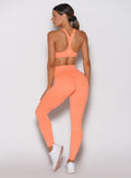 Back view of Citrus Glow Lift Movement Leggings, showing a sculpting high-waisted performance fit.