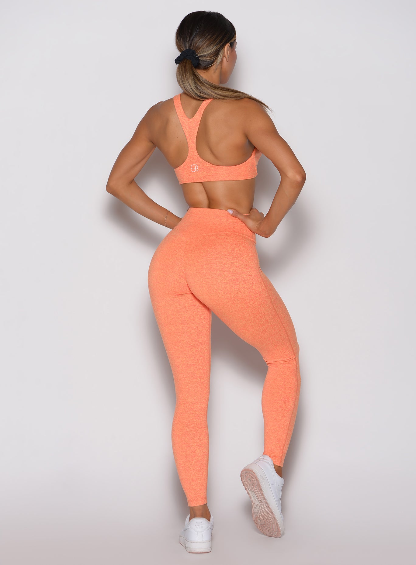 Back side profile of Citrus Glow Lift Movement Leggings, sculpting high-waisted gym activewear.