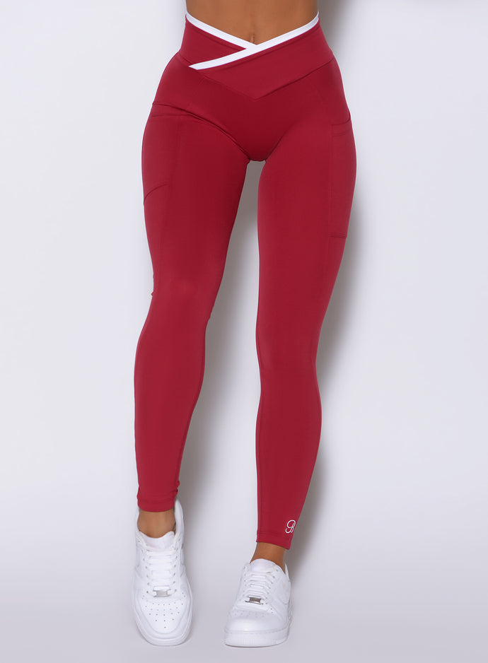 close up frontal shot of a model wearing the Line Contour Leggings in maroon color 