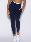 close up frontal view of a model wearing the Line Contour Leggings in navy color 