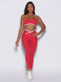 Raspberry Punch Line Contour Leggings featuring a high-waisted crossover V-waistband and white piping.