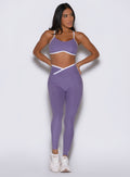 Front view of Violet Line Contour Leggings with white contrast piping and a mid-rise fit.