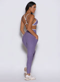 Violet Line Contour Leggings with a V-waist and white contrast piping in a back side profile view.