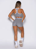 back profile view of a model wearing the Line Contour Shorts in Cloud color