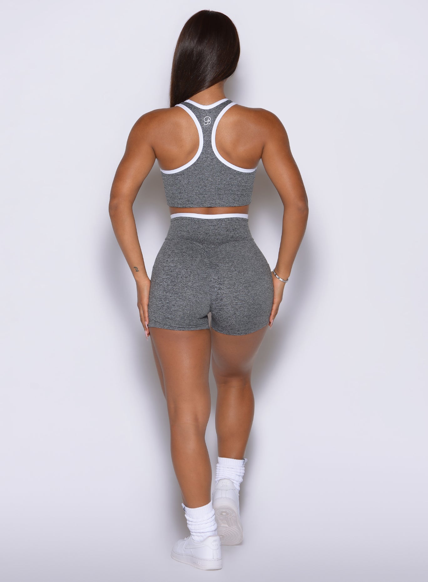 Flattering back silhouette with scrunch detail, pocketed design, and crisp white contrast accents