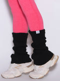 close up left side view of a model wearing the Luxe Leg warmers-short in black color