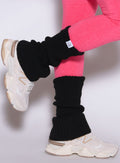 close up right side view of a model wearing the Luxe Leg warmers-short in black color