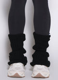 close up front view of a model wearing the Luxe Leg warmers-short in black color