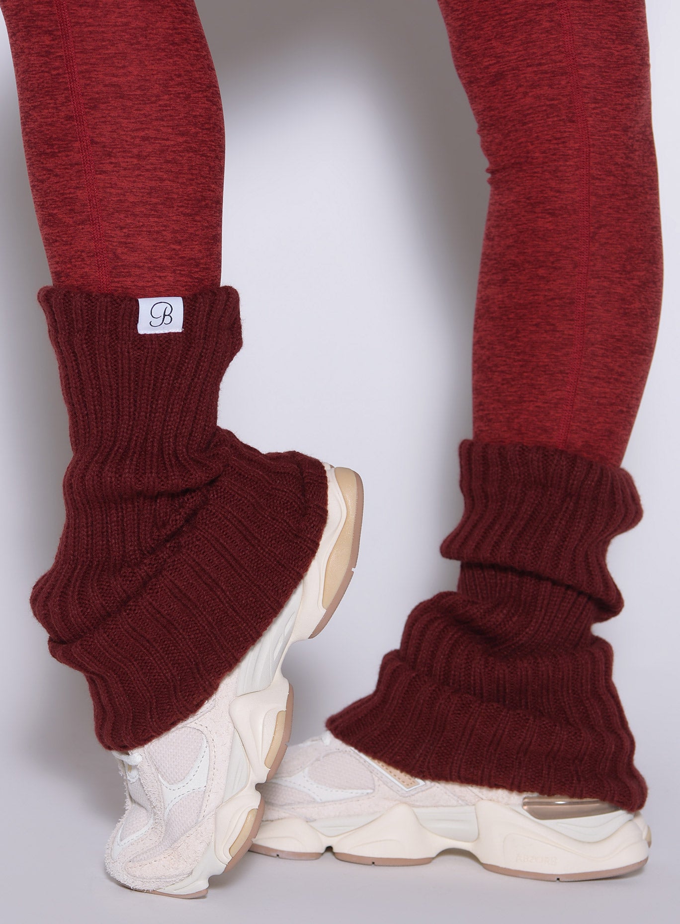 Rouge Luxe Leg Warmers in a chunky rib knit provide a flexible, cozy layer for elite gym styling.