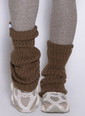 close up front view of a model wearing the Luxe Leg warmers-short in smoked taupe color