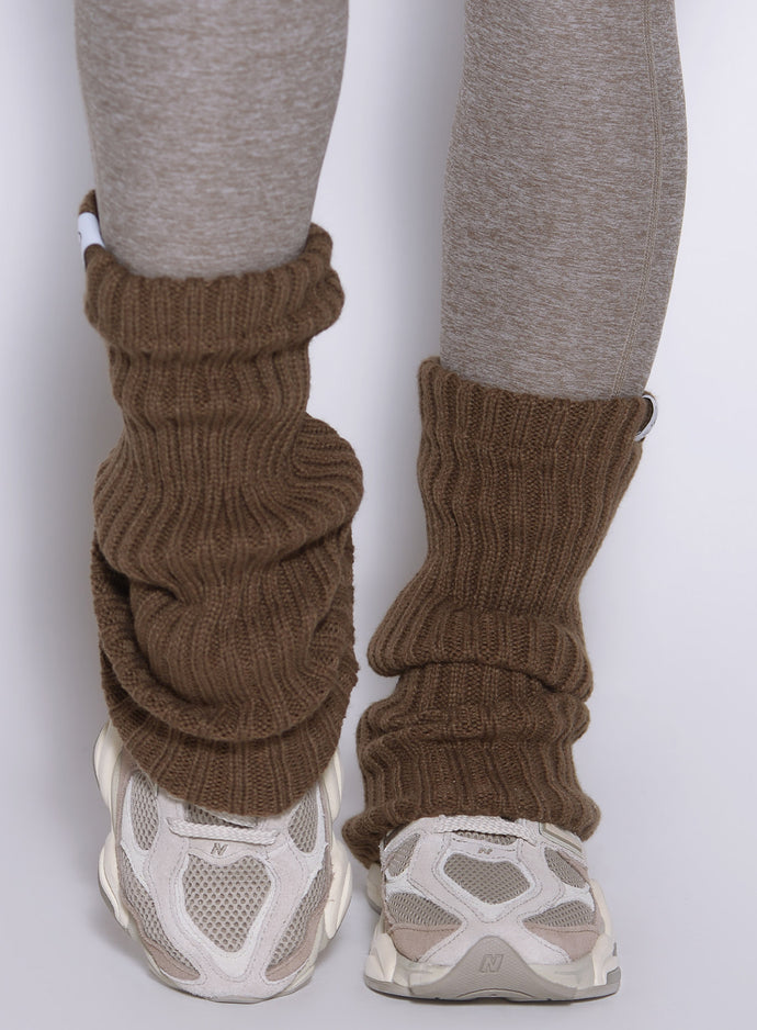 close up front view of a model wearing the Luxe Leg warmers-short in smoked taupe color