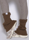 close up left side view of a model wearing the Luxe Leg warmers-short in smoked taupe color