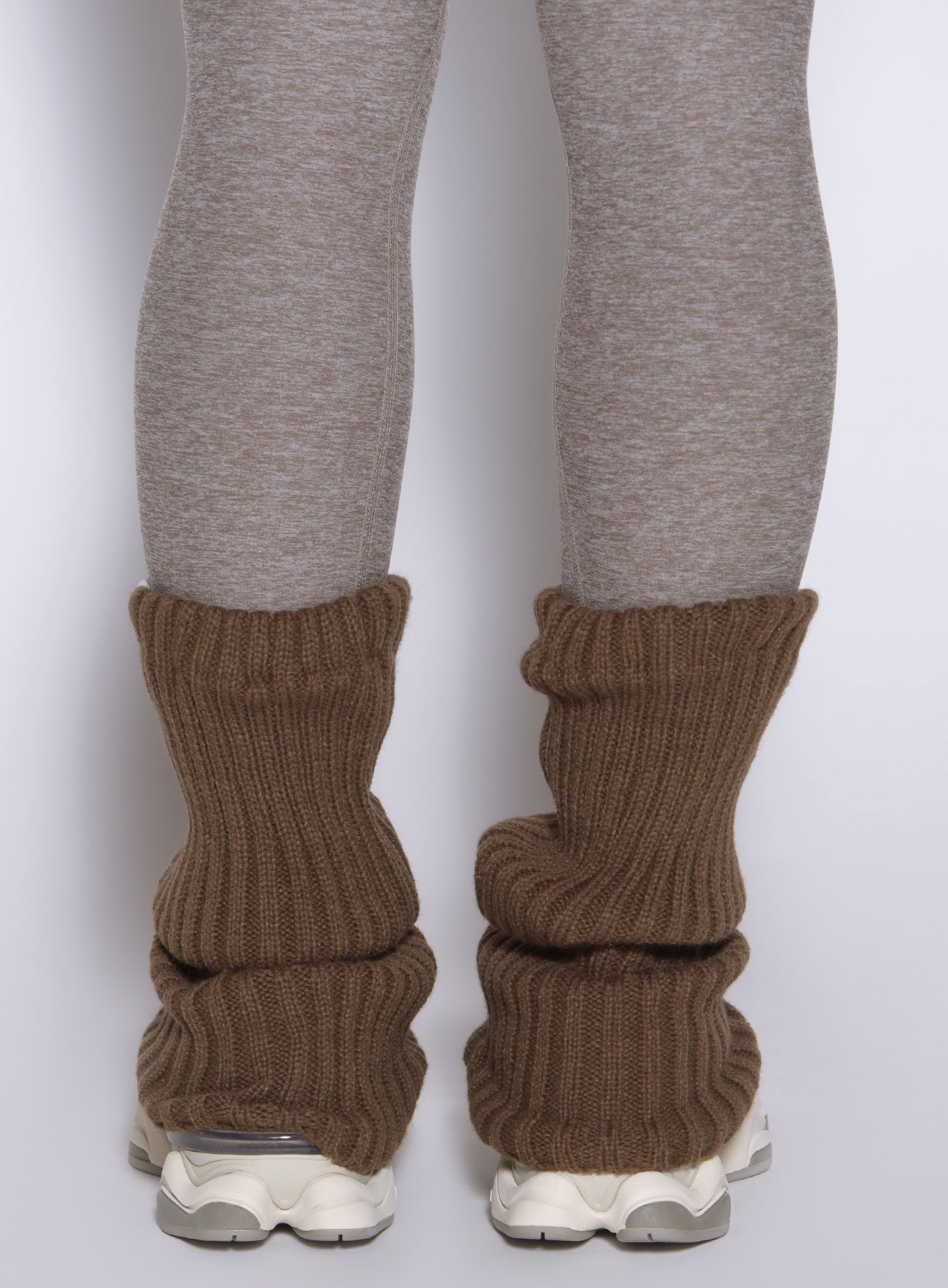 close up view of a model from the back wearing the Luxe Leg warmers-short in smoked taupe color