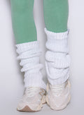 White Luxe Leg Warmers in a short, ribbed knit style for cozy layering over gym leggings.